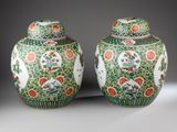 pair of chinese vases decorated with birds and flowers on green ground