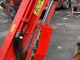 an image of a man working on a construction machine