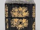an image of a black and gold box on a grey background