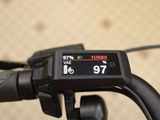 a close up of a bike with a speedometer on it ' s handlebar