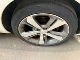 a close up of a tire on a car ' s rim