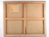 an old picture frame with a piece of paper on top of it