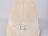 an old helmet with a leather band on a white background