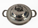 a silver plate with a lid on a white background