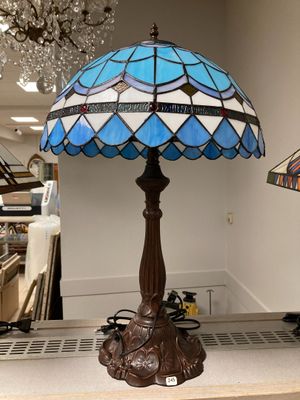 a lamp that is sitting on a table in a room