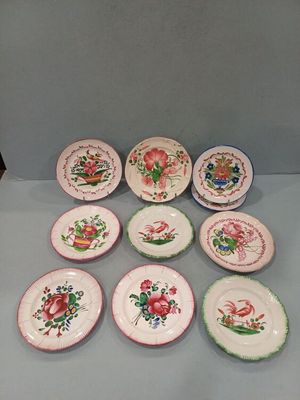 nine plates with different designs on them sitting on a table