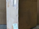 a cardboard box sitting on the floor next to a cardboard box