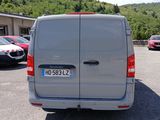a silver van that is parked in a parking lot