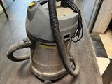 a vacuum cleaner sitting on a wooden floor in a room