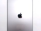 a close up of an apple ipad on a white surface