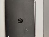 a black laptop sitting on top of a white box