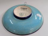 a blue bowl that is sitting on top of a white table