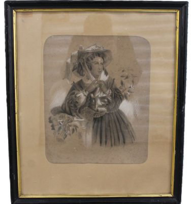 an old picture of a woman holding a cat in her hand