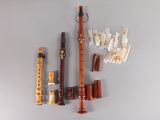 a lot of musical instruments that are hanging on the wall