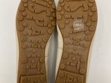 the soles of a pair of shoes on a white surface