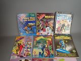 a lot of comic books that are on the table
