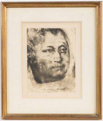 a black and white drawing of a man ' s face in a gold frame