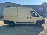 a picture of a white van parked in front of a building