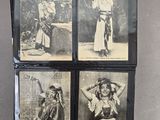 four black and white photographs of women in native clothing are hanging on a wall