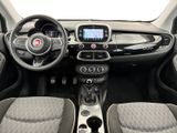 the interior of a small car with a steering wheel and dashboard
