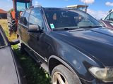 a black suv that is parked in the grass