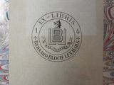 an image of a book sitting on top of a table covered in paper