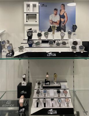 a lot of watches on display in a glass case