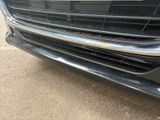 a close up of a car ' s grille with a sticker on it