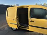 a yellow van with its door open in a parking lot