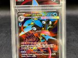 a close up of a pokemon card in a plastic case