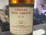 bottle of cognac paul giraud grand cru champagne on a glass table