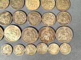 a bunch of coins sitting on top of a table next to each other