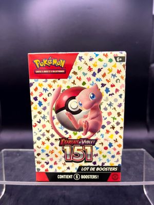 the box for the pokemon card game is sitting on a table