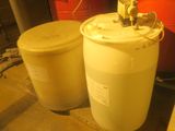 two barrels sitting next to each other in a room