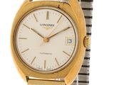 a close up of a gold and silver wrist watch with a white dial