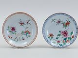 pair of chinese famille plates with flowers and leaves