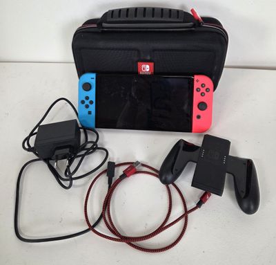 a nintendo wii game system and accessories on a table