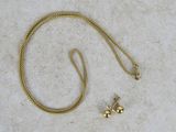 yellow gold plated necklace and earring set on a white background