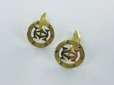 a pair of gold plated cufflinks with initials