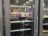 two glass doors that are open in a building