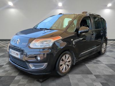 the black citrole van is parked in a room with a checkered floor