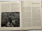 an open book with pictures of airplanes flying in the sky