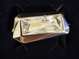 an image of a gold ring with a diamond in it