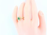 an image of a woman ' s hand with a ring on it
