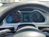 a close up of a car dashboard with various gauges