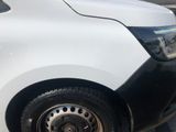 a white van that is parked in a parking lot