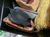 a black box filled with assorted items on a table