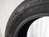 a tire that is sitting on a white surface