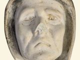 a statue of a man with a hood on his head