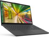 l'ordinateur portable est ouvert sur une surface blanche, avec une image floue à l'écran